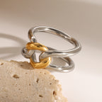 Angled view of the gold-tone link joining silver-tone bands