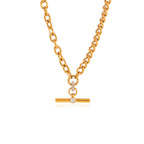 Gold-tone T-bar necklace laid on white