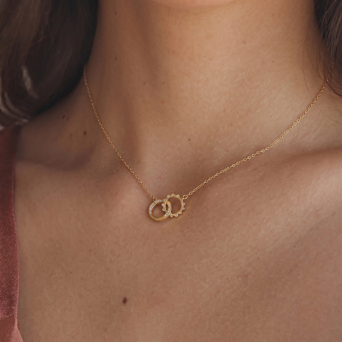 Sunburst circle pendant necklace worn on its own