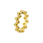 white-background view of polished brass pebble ring