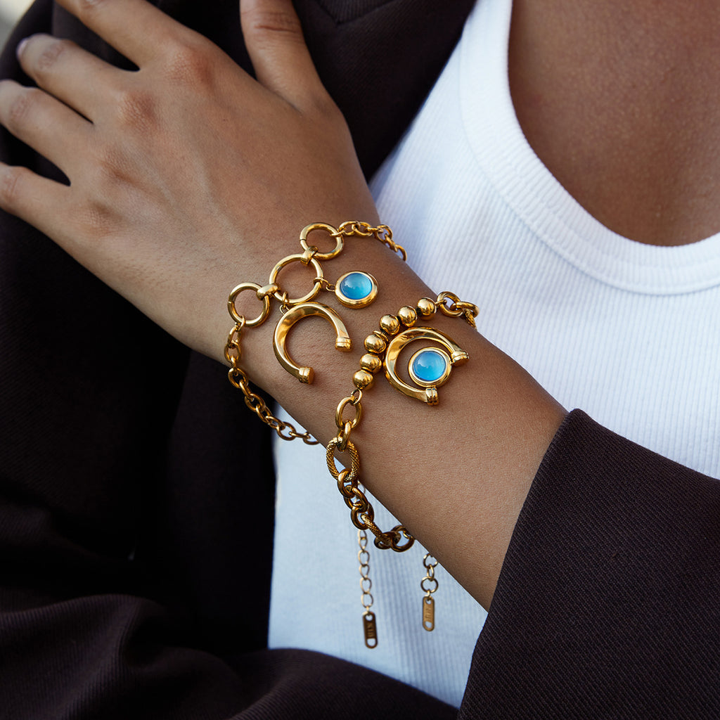 Gold-Tone Blue Resin Equestrian Stainless Steel Bracelet Collection — front view