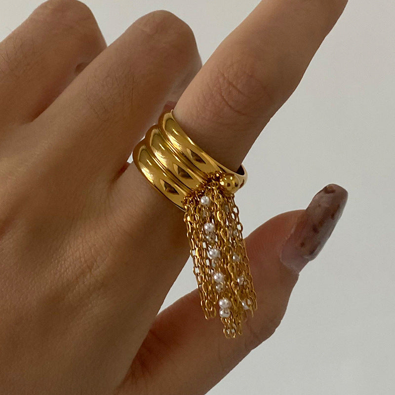 Triple-row tassel ring worn on a hand