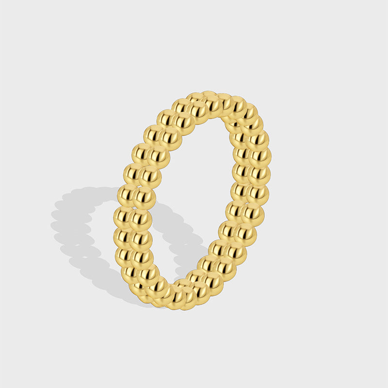 isolated gold plated double-row beaded band ring