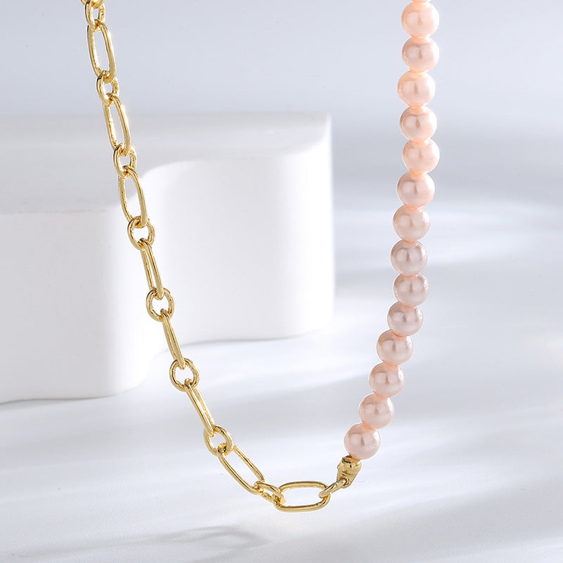 close view of the chain-to-bead transition on pink shell necklace