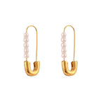 Front view of elongated pin earrings with white pearl rows
