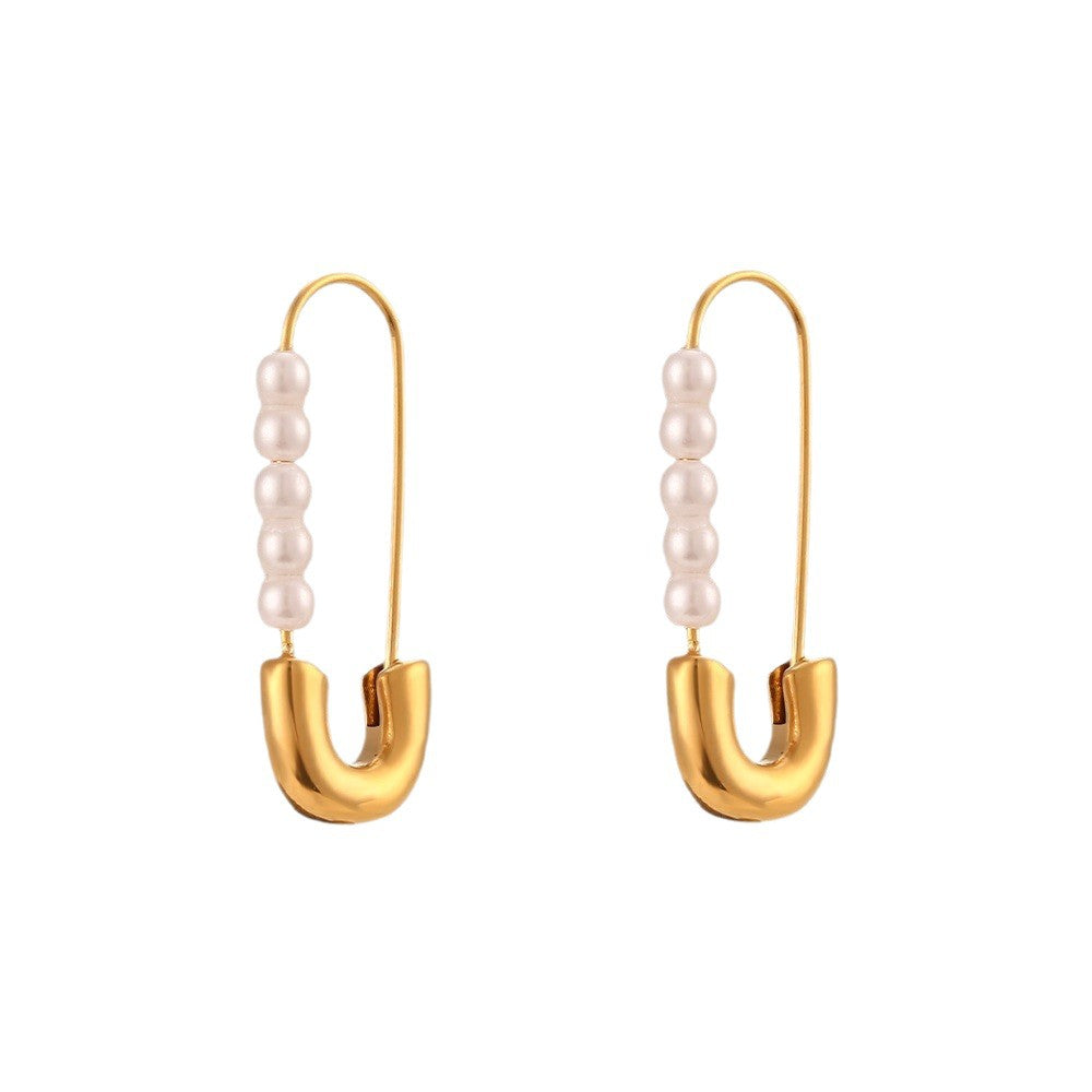 Front view of elongated pin earrings with white pearl rows