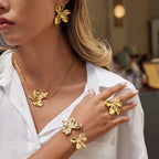 Gold-Tone Stainless Steel Sculptural Floral Jewelry Collection — detail view