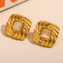 gold plated woven square studs with beige cat's-eye centers