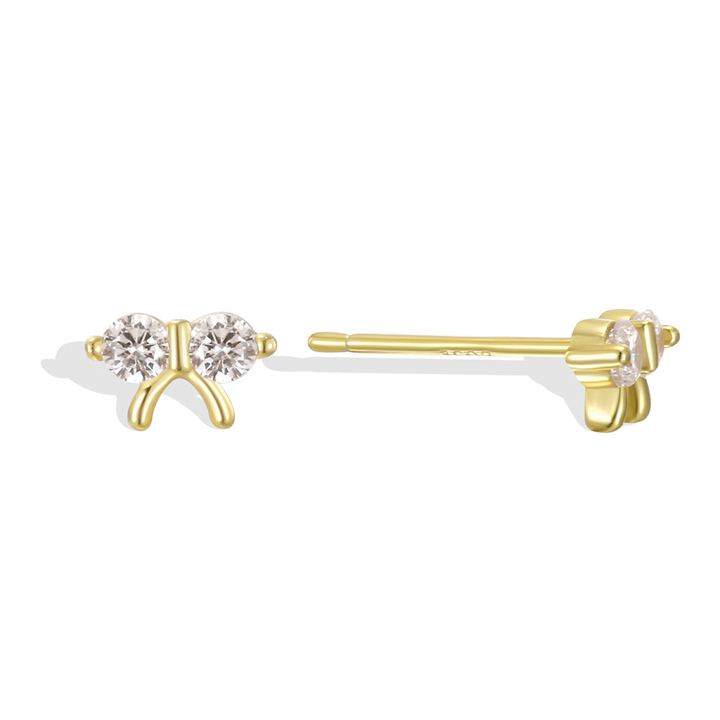 isolated front and side view of gold plated twin-stone bow studs