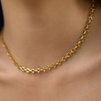 Textured heart-link stainless steel necklace at the neckline