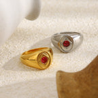 pair of red stone signet rings in gold plated and silver finishes