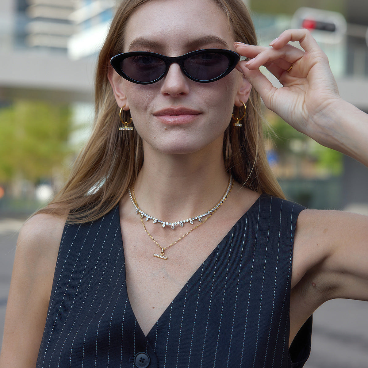 T-bar necklace and earrings styled on a model
