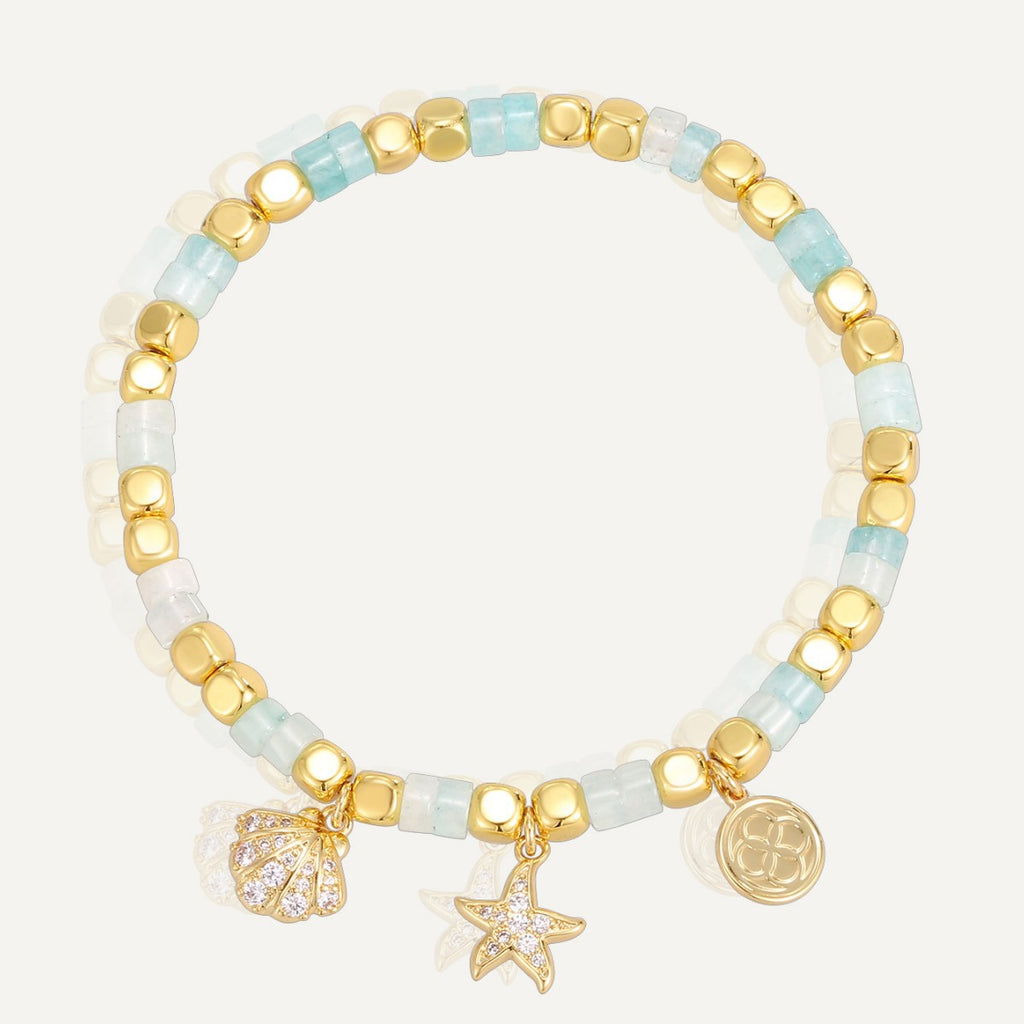 aqua and white beaded bracelet with shell and starfish charms