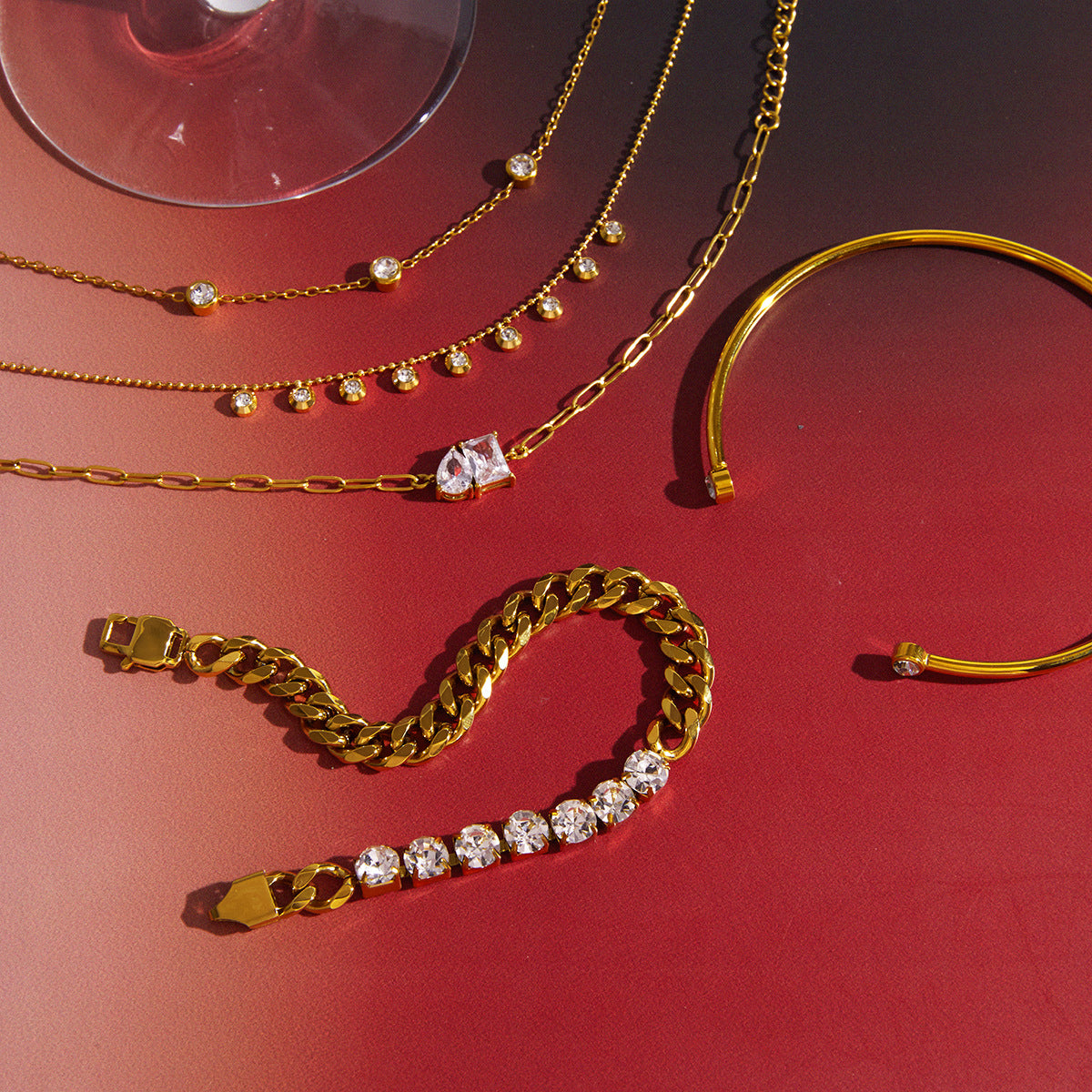 Gold-tone necklace and bracelet options arranged for comparison