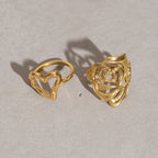 Two openwork rings displayed from an angle
