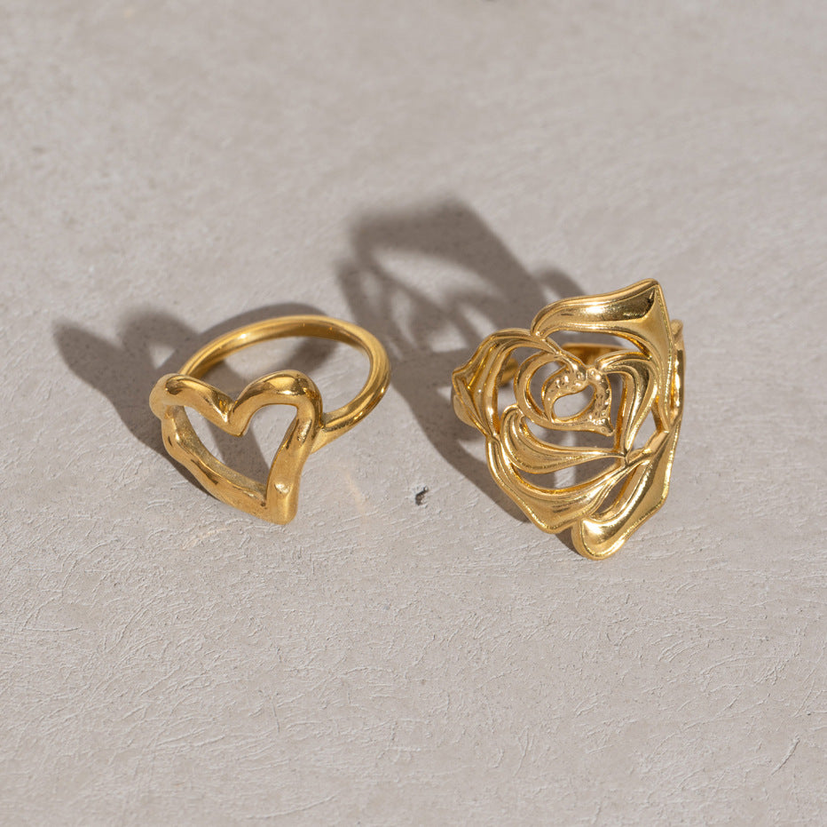 Two openwork rings displayed from an angle