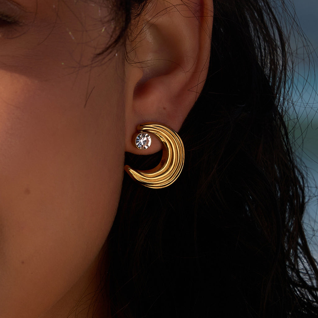 Ridged crescent moon stainless steel stud earring shown worn