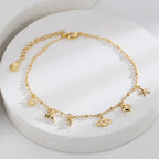 whale-tail starfish eye and heart charm anklet on white