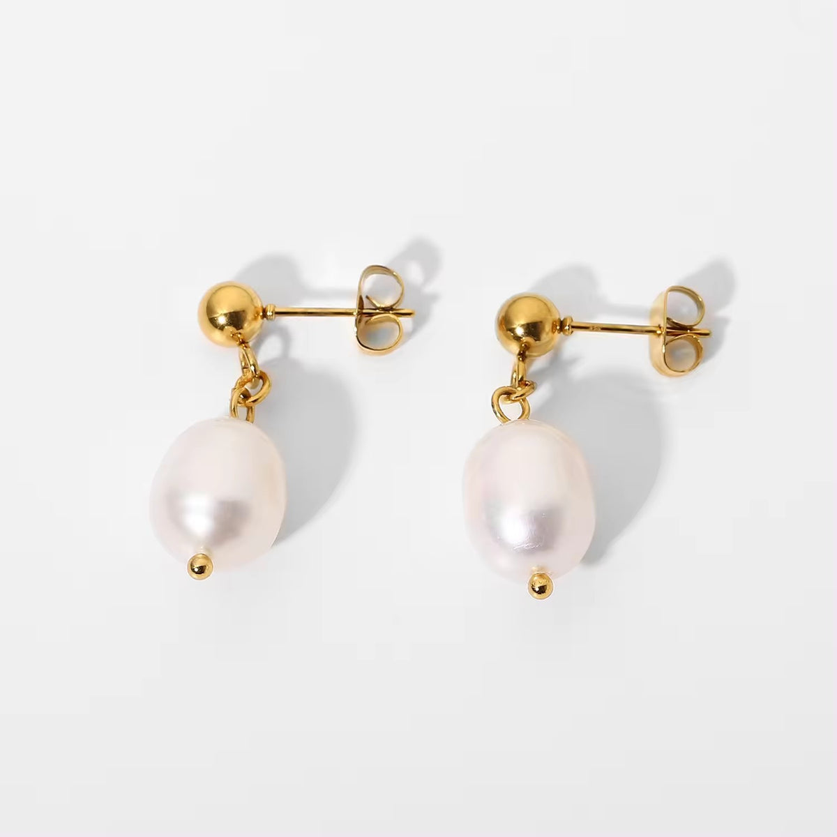 Minimal white bead drop stud earrings front view