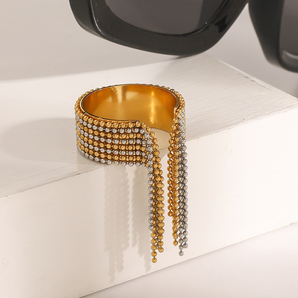Angled view of beaded rows and hanging ring fringe