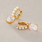 Pearl-look hoops with clear cushion-shaped drops