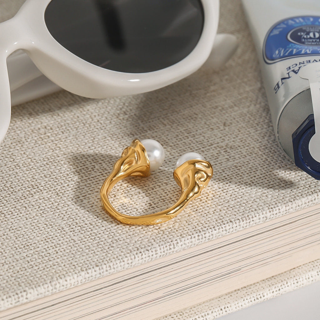 Side view of sculpted mounts on the double-bead open ring