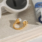 Side view of sculpted mounts on the double-bead open ring