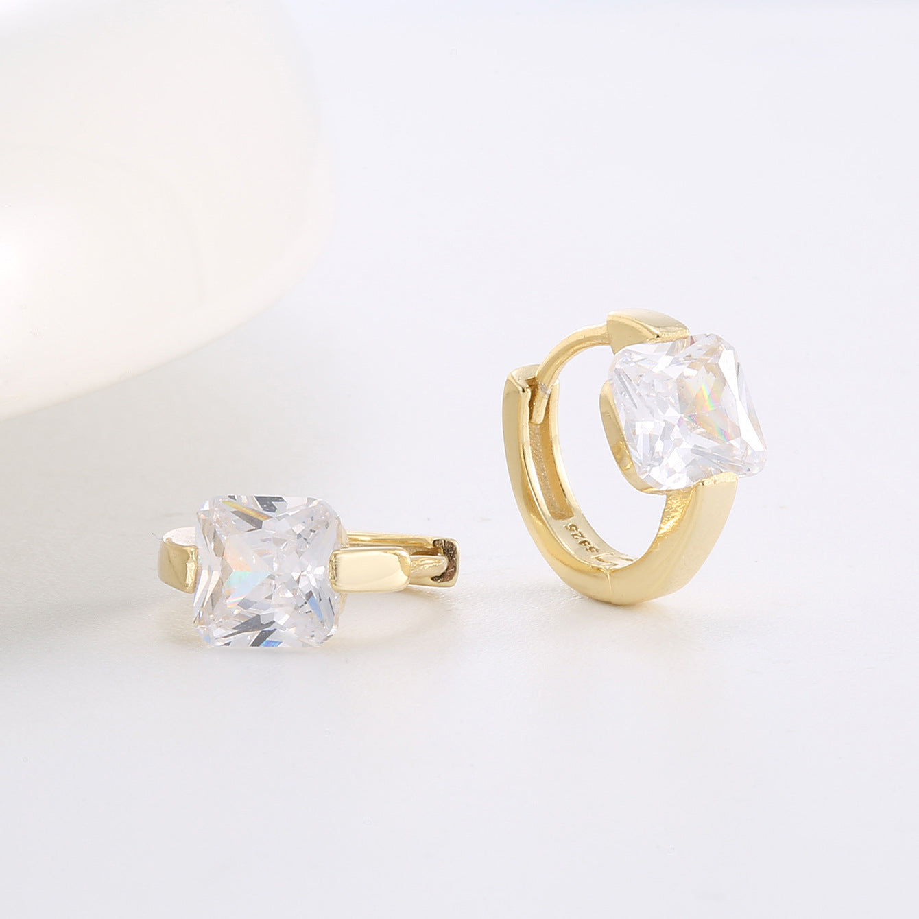 Gold Plated 925 Sterling Silver Square Zirconia Hoop Earrings — one hoop laid flat showing stone profile