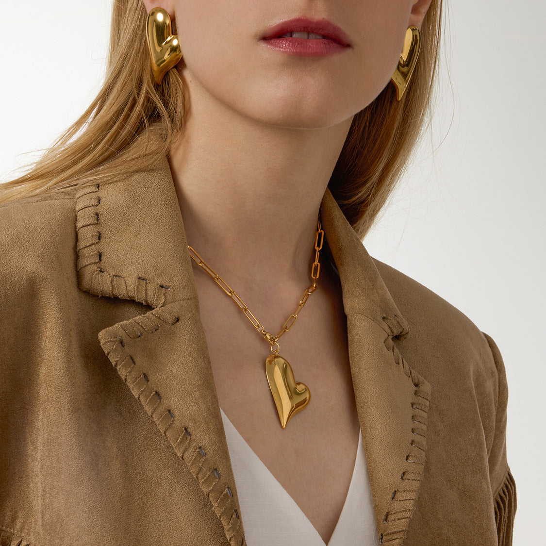 Gold-Tone Heart Stainless Steel Earrings and Necklace Collection shown on model