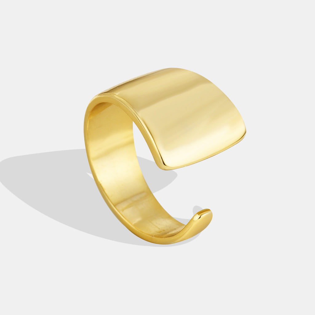 gold plated brass sculptural ring with broad foldover face
