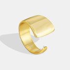 gold plated brass sculptural ring with broad foldover face