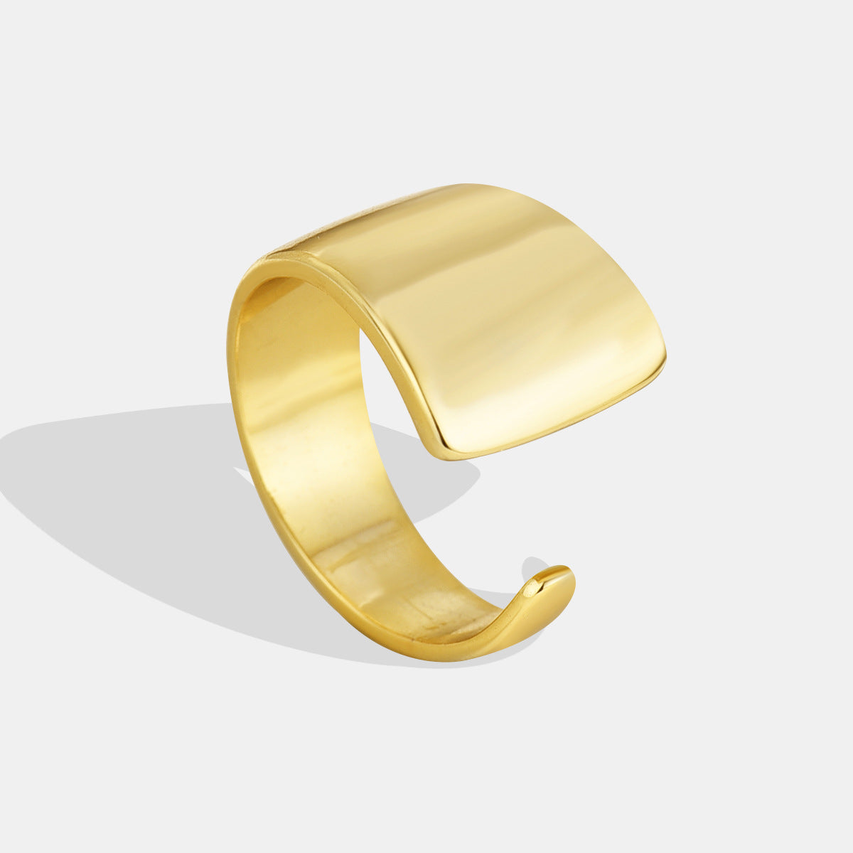 gold plated brass sculptural ring with broad foldover face