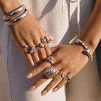 gold plated and silver-finish lattice dome rings styled on hands