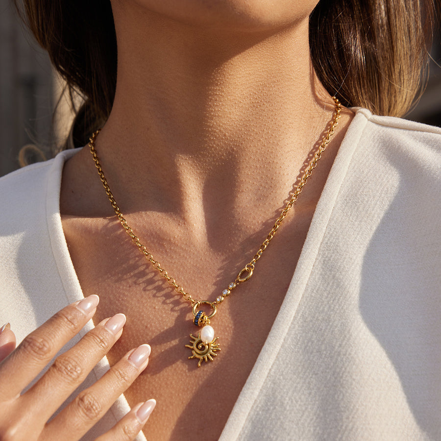 gold plated spiral sun freshwater pearl necklace worn on model