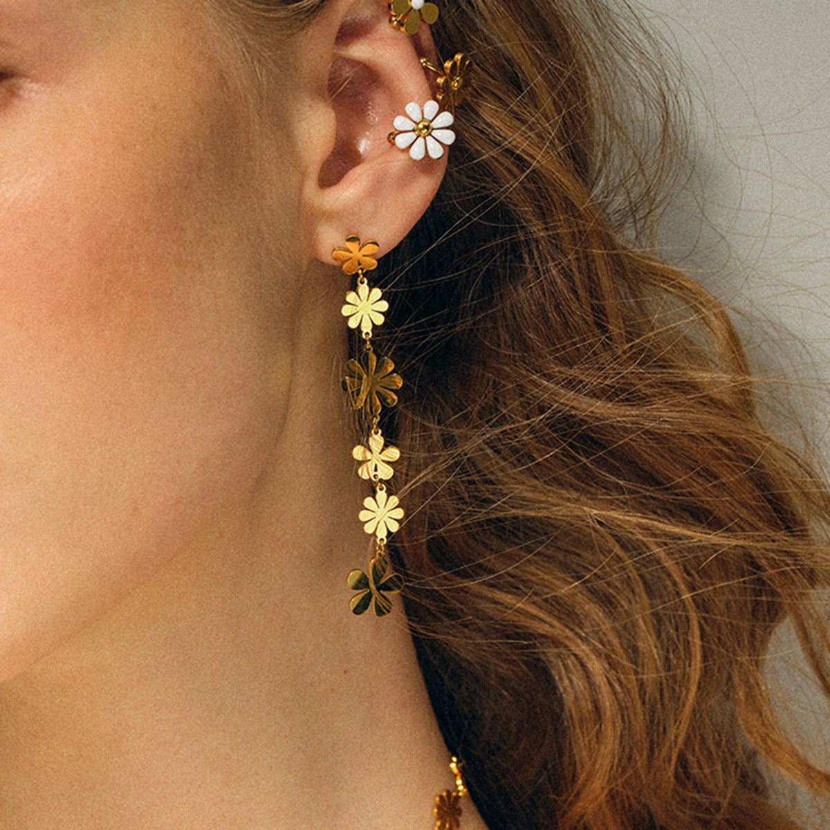 Gold-Tone Daisy Chain Stainless Steel Drop Earrings shown on model