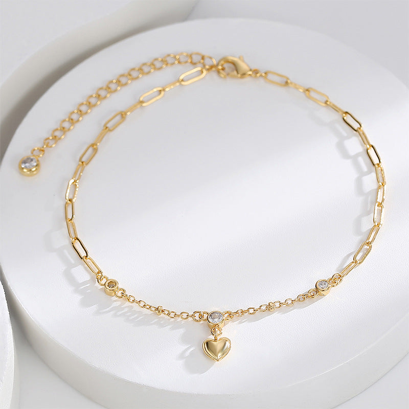 heart drop and clear stone station anklet on white display