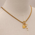 Gold-Tone Stainless Steel Lock Charm Necklace with Pearl-Look Drop — detail view