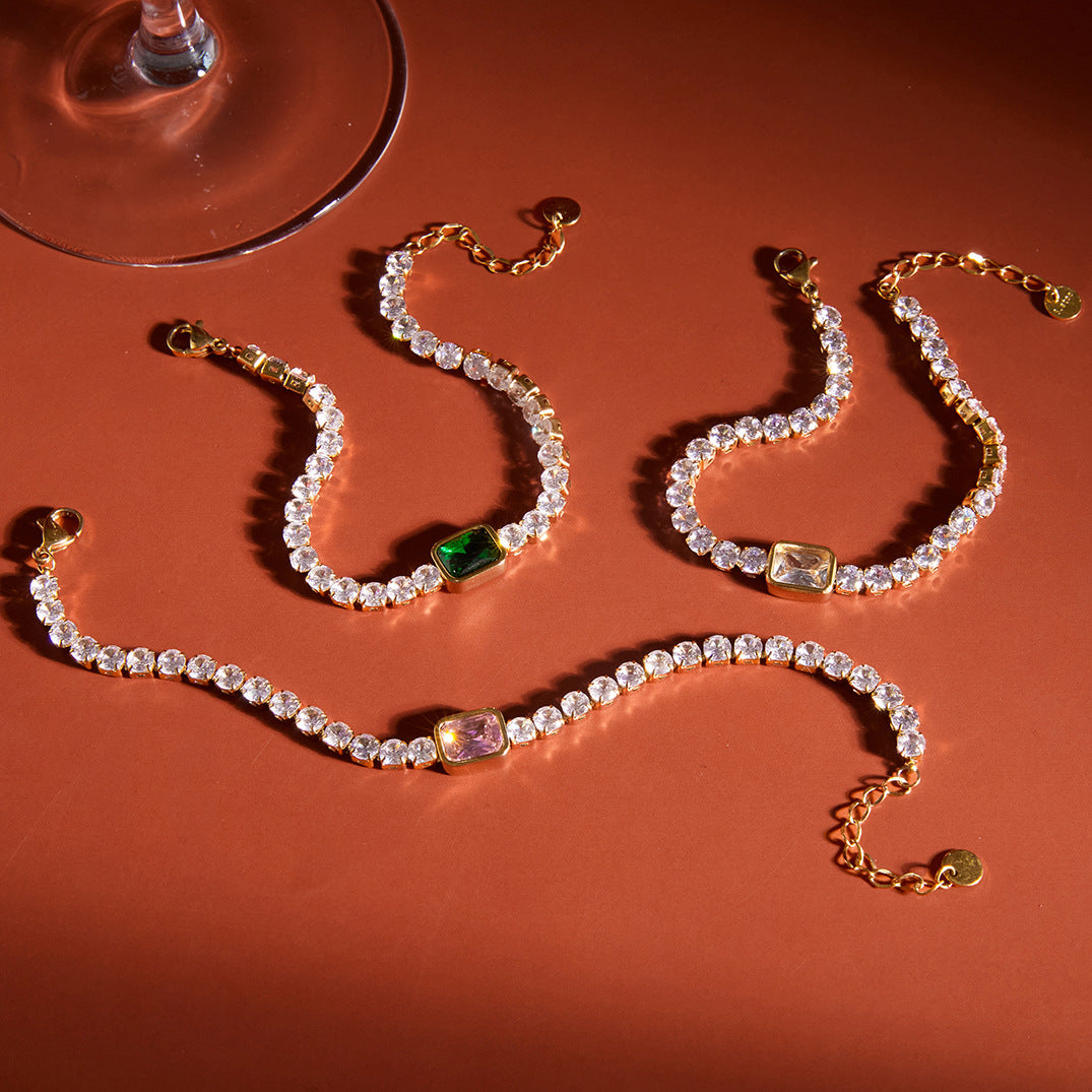 Colored-center tennis bracelets on orange fabric