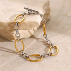 Two-tone oval link bracelet styled on stone