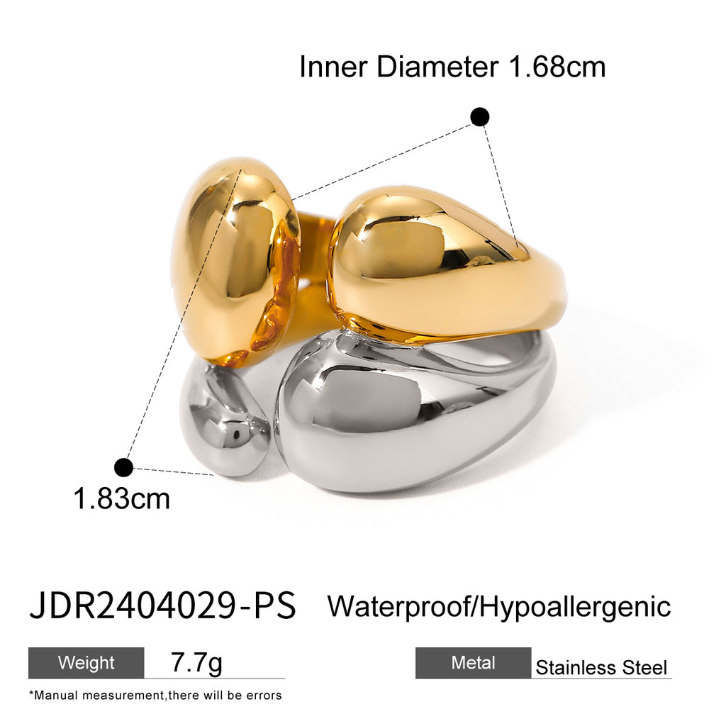 Open ring with rounded gold and silver tone ends