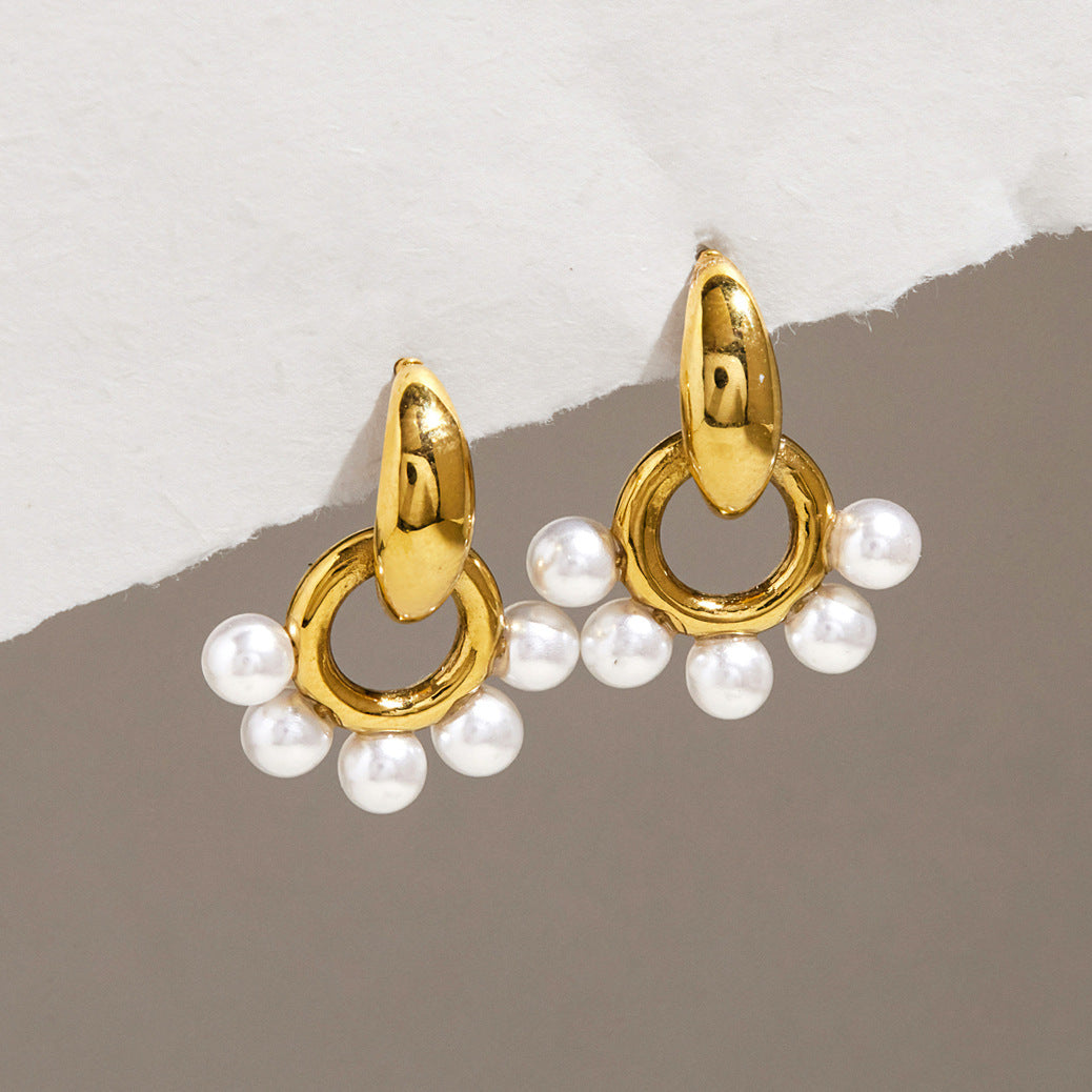 Gold-tone circular drops edged with white resin pearls