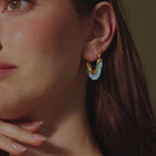 Blue marbled resin hoop worn close-up