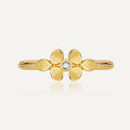 front view of gold plated brass clover ring with clear center stone