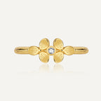 front view of gold plated brass clover ring with clear center stone