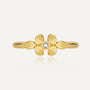 front view of gold plated brass clover ring with clear center stone