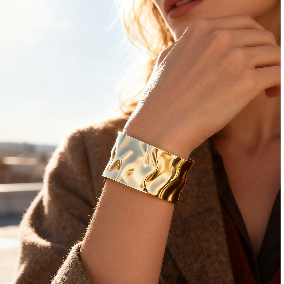 sculptural hammered cuff bracelet shown in a wrist close-up