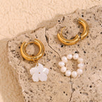 gold plated hoops with separate pearl-loop and white shell-flower charms