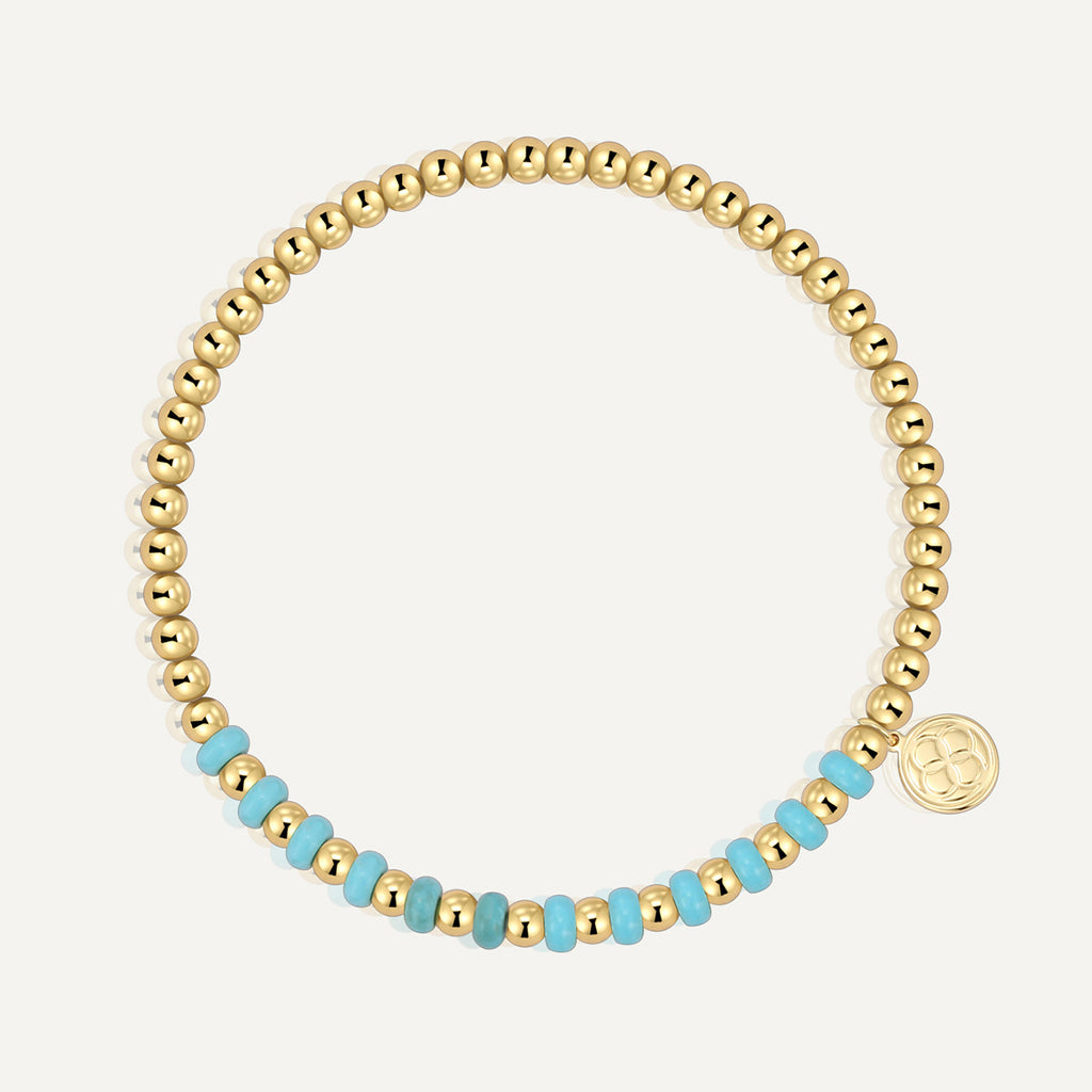 gold plated round bead bracelet with turquoise-color accent section
