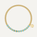 gold plated round bead bracelet with turquoise-color accent section