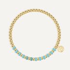 gold plated round bead bracelet with turquoise-color accent section